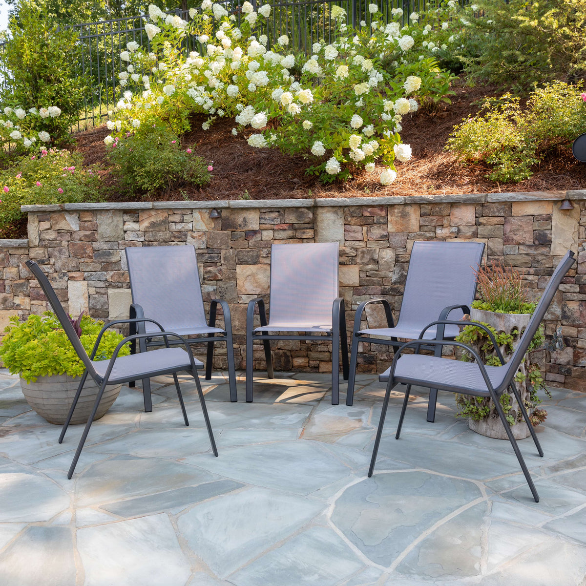 2026 NewBizChair 5 Pack Black Outdoor Stack Chair with Flex Comfort Material and Metal Frame